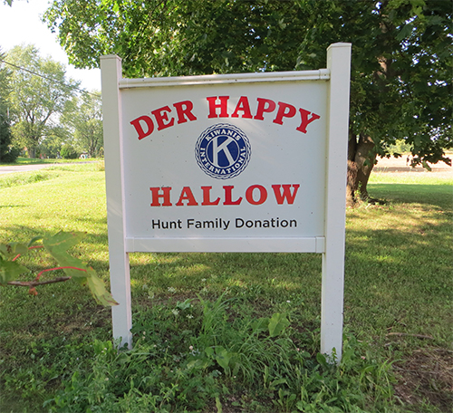 Sign for Der Happy Hallow at driveway